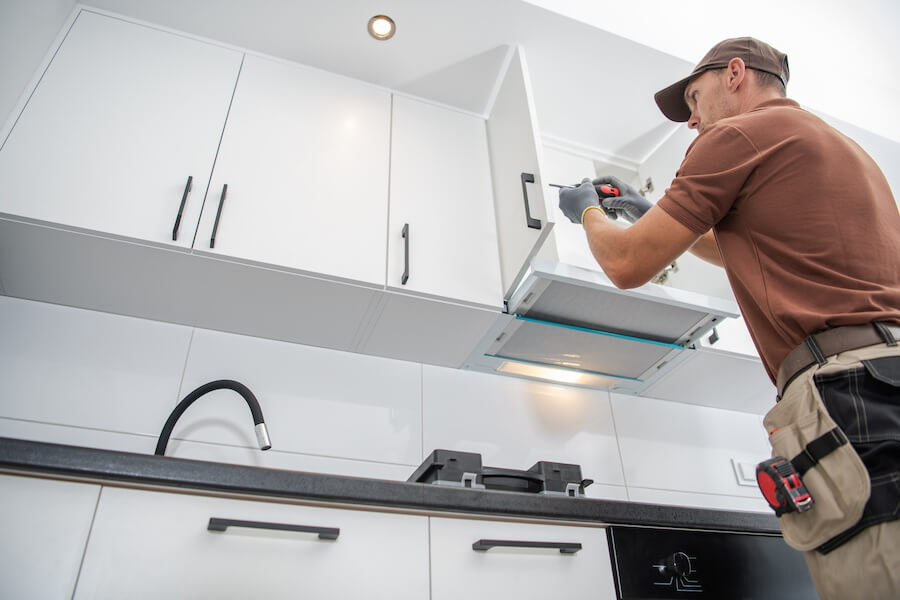 Contractor assembling kitchen cabinets