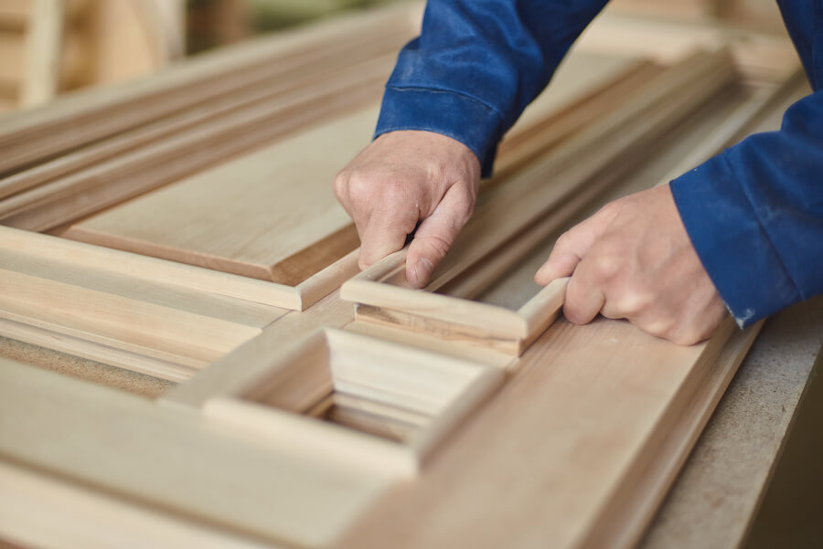 carpenter joining parts to a door